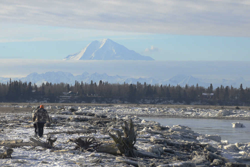 Ben Boettger/Peninsula Clarion A plume of steam rises from the side of Mt. Redoubt, seen from the banks of the Kenai River on Wednesday, Feb. 11.  "When it's windy, (the steam) gets whisked away, but when it's calm and clear, it usually has a chance to stay and linger about," said geologist Game McGimsey of the Alaska Volcano Observatory. According to AVO, the steam does not indicate a coming eruption.  "There is nothing unusual happening at Mt. Redoubt," McGimsey said.