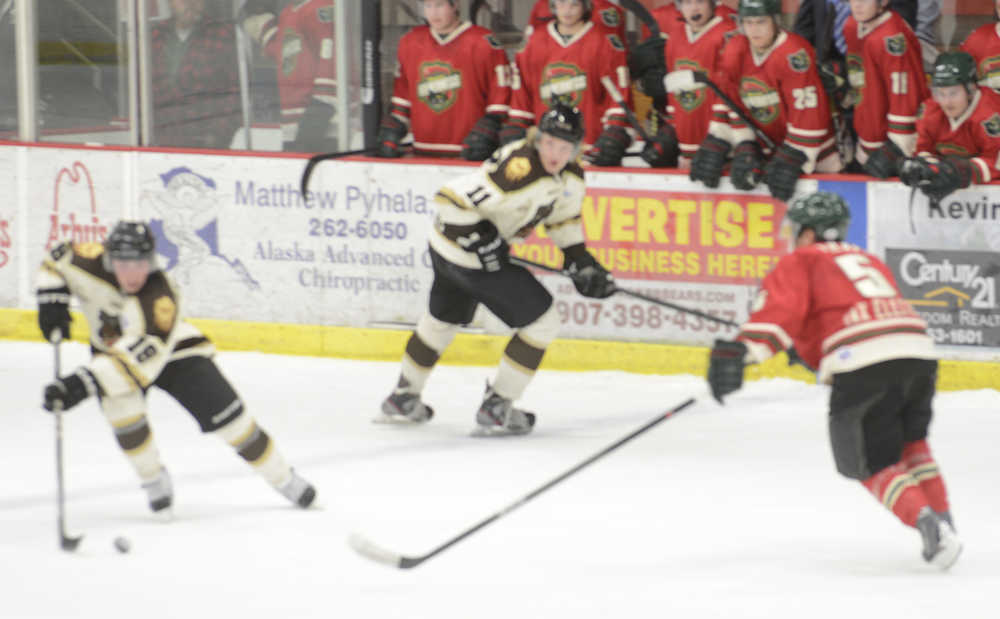 Photo by Kelly Sullivan/ Peninsula Clarion Kenai River Brown Bears' Sam Carlson turns to follow the puck during a game against Wenatchee Wild Oct. 26, 2014, at the Soldotna Regional Sports Complex in Soldotna, Alaska.