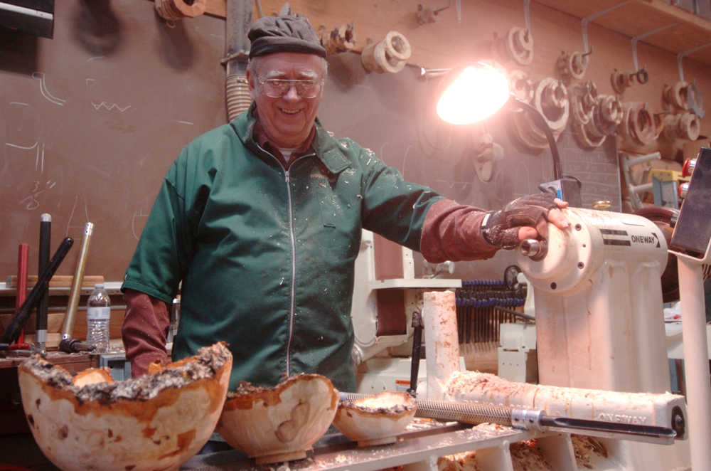 Ben Boettger/Peninsula Clarion Al Janonis with three birch bowls he carved on an electric lathe at a Kenai Peninsula Woodturner's meeting at the "3 Guys, No Wood" workshop on Saturday, Feb. 14.