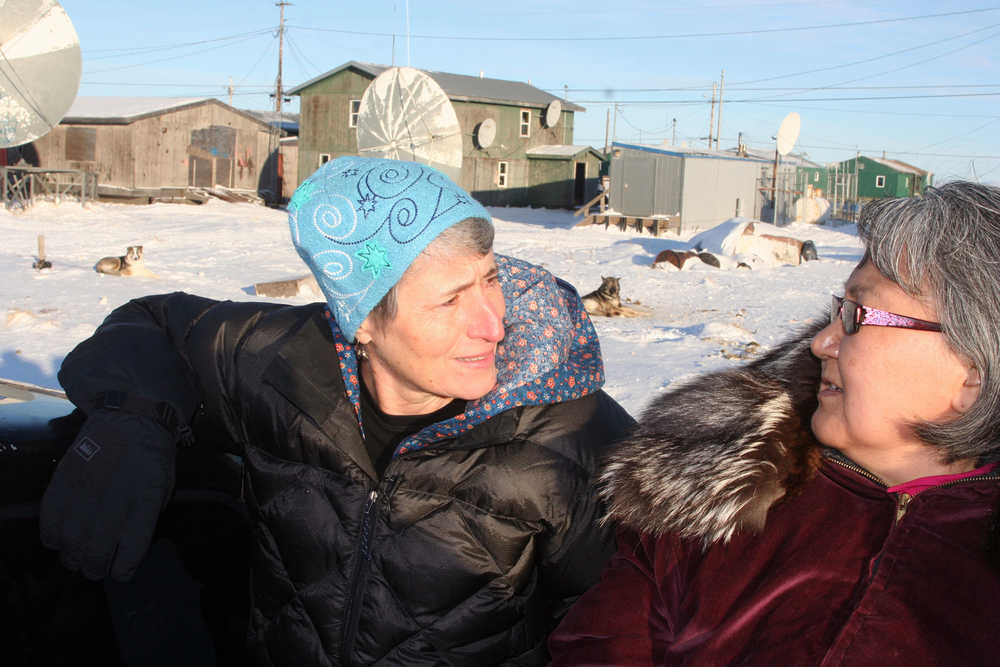 U.S. Interior Secretary Sally Jewell, left, tours Kivalina, Alaska in the back of a pickup with village resident Millie Hawley on Monday, Feb. 16, 2015.  In temperatures slightly higher than Washington, D.C.'s, Jewell got a firsthand look Monday at the effect of climate change on an Alaska coastal community. Jewell visited Kivalina, a village of 370 on a barrier island just off Alaska's northwest coast. (AP Photo/Fairbanks Daily News-Miner, Casey Grove)