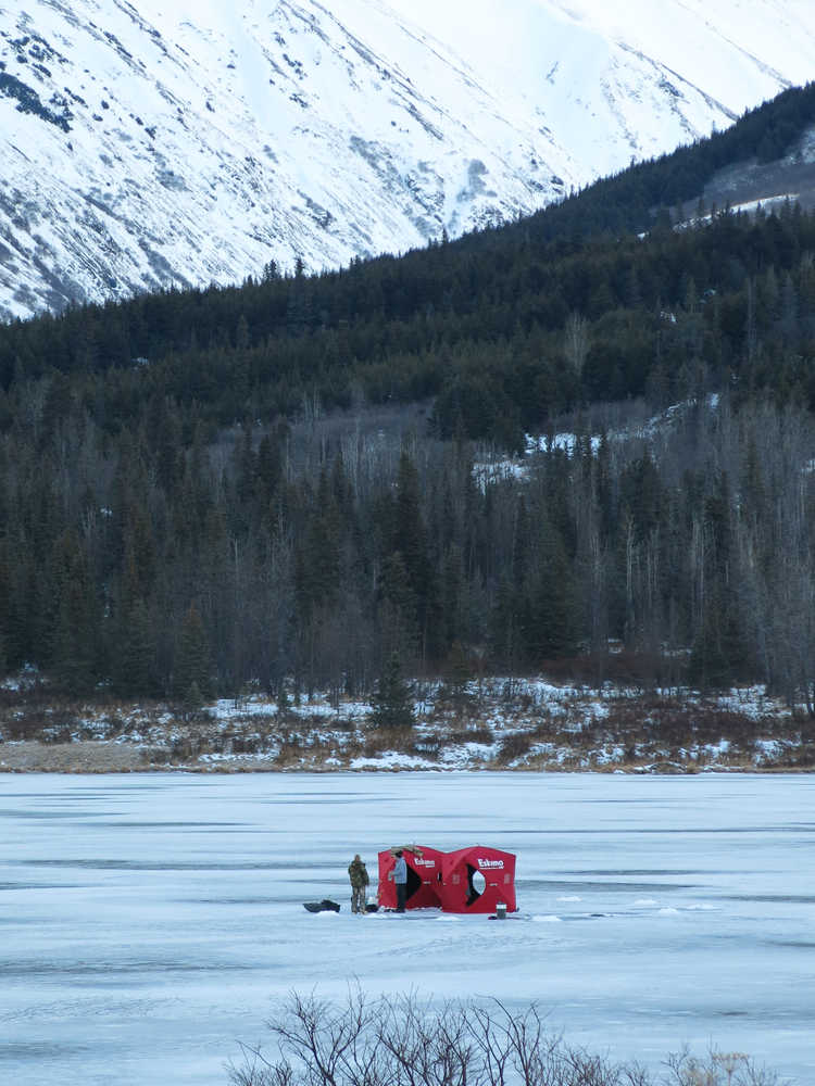 A group of ice fishers sets up on Summit Lake recently.