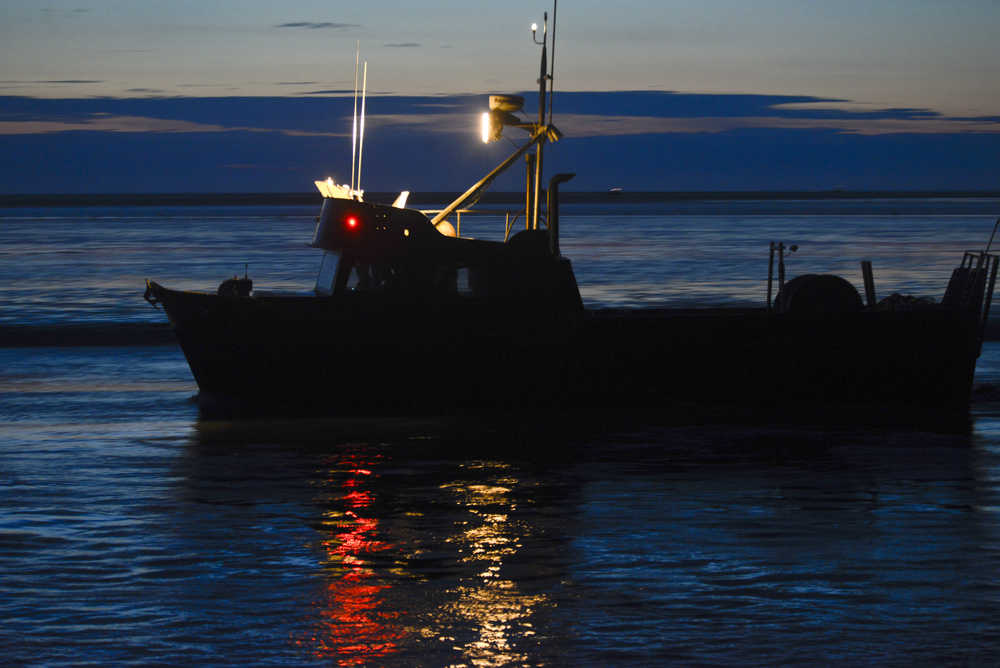 Photo by Rashah McChesney/Peninsula Clarion A commercial drift gillnetting boat leaves the mouth of the Kasilof River at about 1 a.m. Thursday morning July 17, 2014 during an overnight fishing period in Kasilof, Alaska.