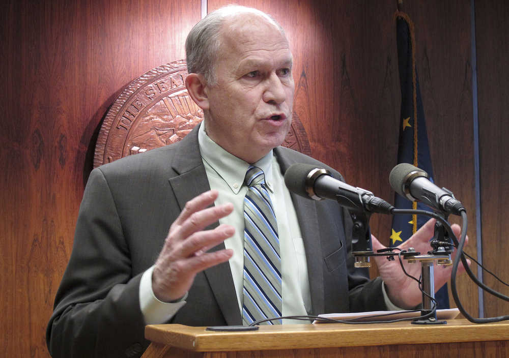 Gov. Bill Walker speaks with reporters during a news conference on his plans to seek dismissal of a lawsuit he brought before taking office involving the Point Thomson oil and gas field, on Wednesday, Feb. 11, 2015, in Juneau, Alaska. (AP Photo/Becky Bohrer)