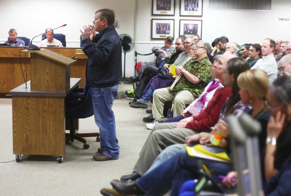 Photo by Kelly Sullivan/ Peninsula Clarion Eric Durleth was the first to speak at the Kenai Peninsula Borough Building location during public comment at the Borough Assembly meeting Tuesday. Durleth spoke in against the ordinance, introduced by assembly member Kelly Wolf, that would put a proposition on the Oct. 6, 2015 regular election ballot asking voters whether or not commercial marijuana cultivation facilities should be banned in the borough's unincorporated areas.