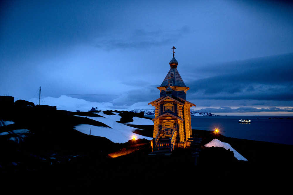 In this Feb. 1, 2015 photo, Holy Trinity church stands illuminated at Russia's Bellinghausen station on King George Island in Antarctica. Holy Trinity is the world's southernmost Eastern Orthodox Church. (AP Photo/Natacha Pisarenko)