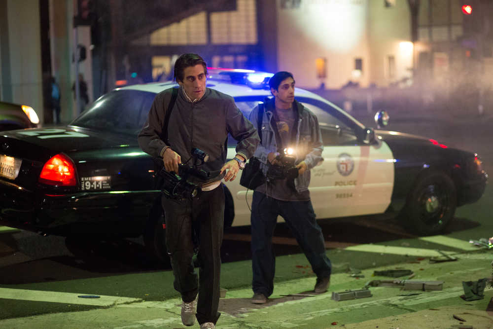 In this image released by Open Road Films, Jake Gyllenhaal, left, and Riz Ahmed appear in a scene from the film, "Nightcrawler." (AP Photo/Open Road Films, Chuck Zlotnick)