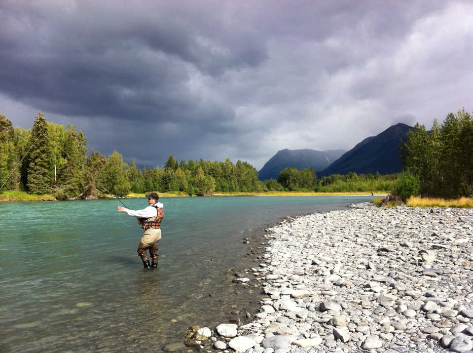 An angler enjoys a day of fishing on the banks of the upper Kenai River within the Kenai National Wildlife Refuge. (Photo courtesy Kenai National Wildlife Refuge)