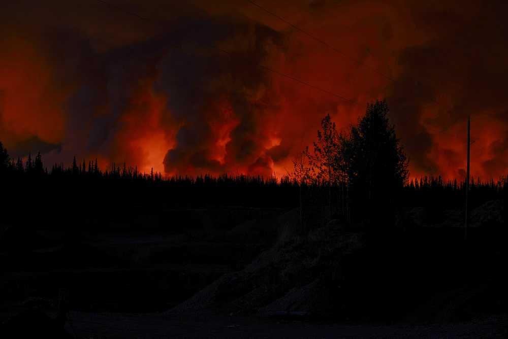 Photo by Rashah McChesney/Peninsula Clarion   The sky above many portions of Kasilof glowed orange Wednesday May 21, 2014 as the Funny River Fire continued to burn a more than 10 mile strip of land stretching from Funny River Road in Soldotna down to Tustumena Lake. Firefighters estimate that more than 20,000 acres have been burned in the blaze.