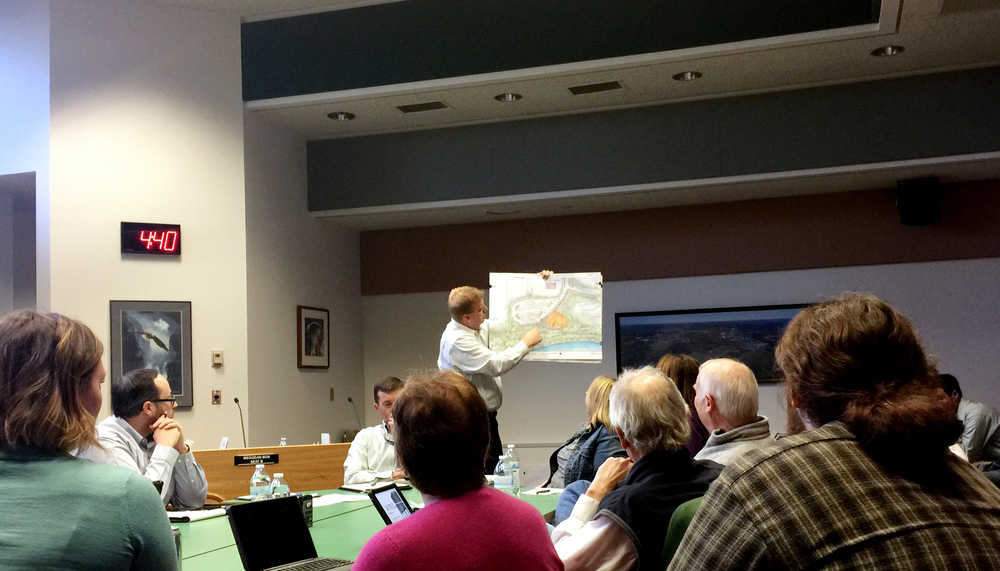 By IAN FOLEY/Peninsula Clarion Soldotna Chamber of Commerce President Ryan Kapp shows a map of a proposed location for the city's new visitor center and chamber building on Wednesday, March 11 at Soldotna's City Hall.