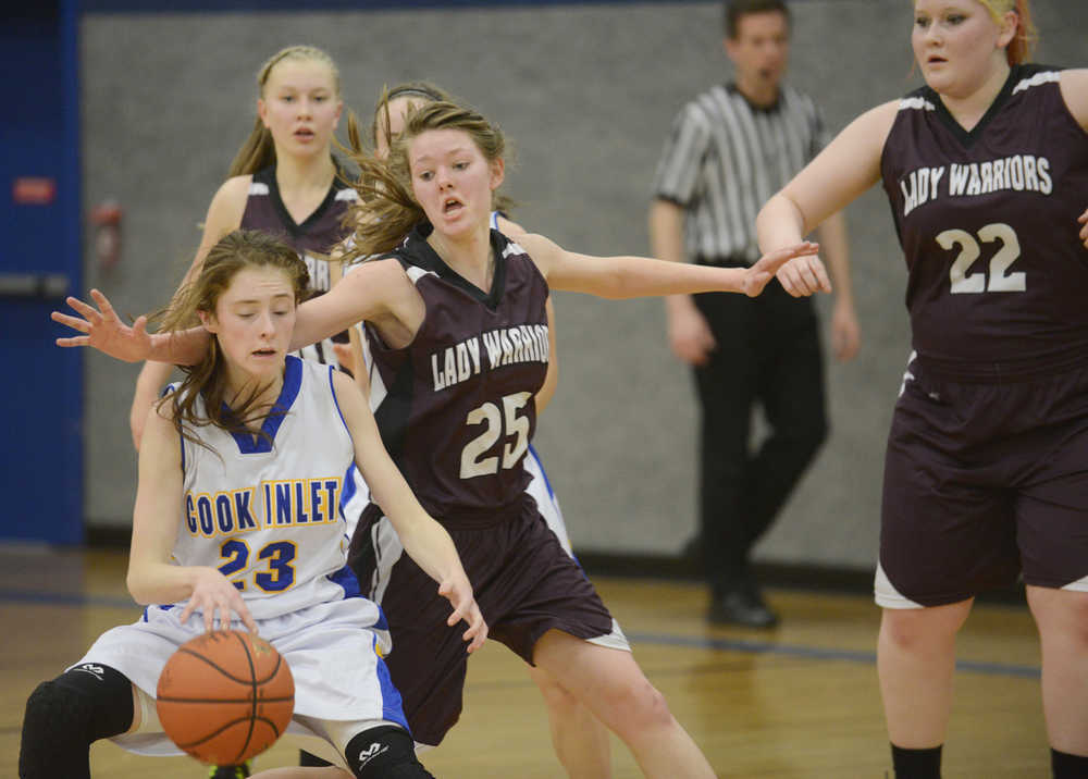 Photo by Kelly Sullivan/ Peninsula Clarion Cook Inlet Academy Eagle Ashleigh Hammond avoids a steal from Nikolaevsk Warrior Megan Hickman, Thursday at Cook Inlet Academy in Soldotna.