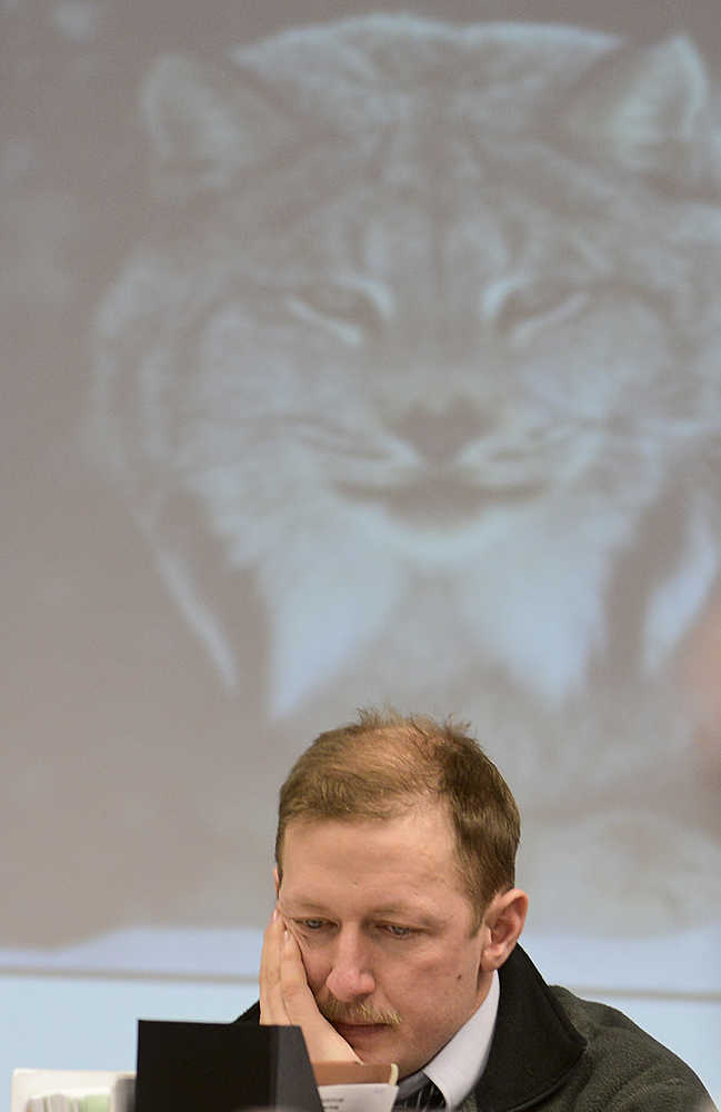 Photo by Rashah McChesney/Peninsula Clarion Nate Turner, vice-chairman of the Board of Game, listens to a presentation on lynx tracking in Southcentral Alaska on Friday, March 13, 2015 in Anchorage, Alaska.