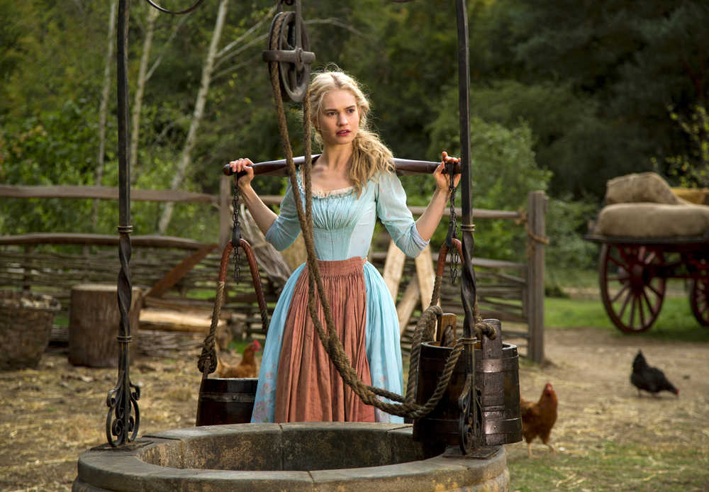 This image released by Disney shows Lily James as Cinderella in Disney's live-action feature film inspired by the classic fairy tale, "Cinderella." (AP Photo/Disney, Jonathan Olley)