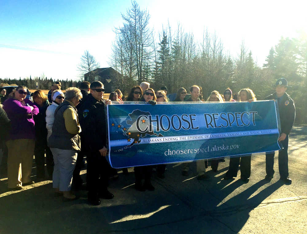 Photo by Ian Foley/Peninsula Clarion Members of the community gather before the start of the Choose Respect march held in Kenai on Tuesday.