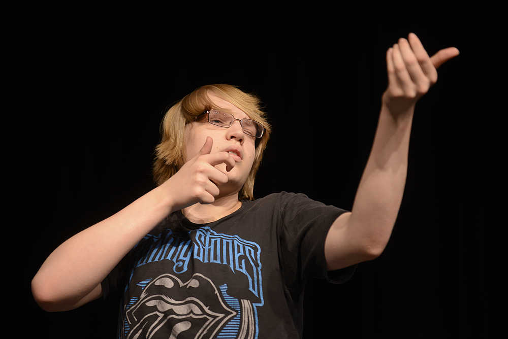 Photo by Rashah McChesney/Peninsula Clarion  Josh (Logan Schoessler) pantomimes shooting a deer during the Soldotna High Drama Troupe's rehearsal for their production of "Bang Bang You're Dead" on Tuesday March 24, 2015 in the Soldotna High School auditorium. The show will run Thursday through Saturday at 7 p.m. Tickets are $10 at the door.