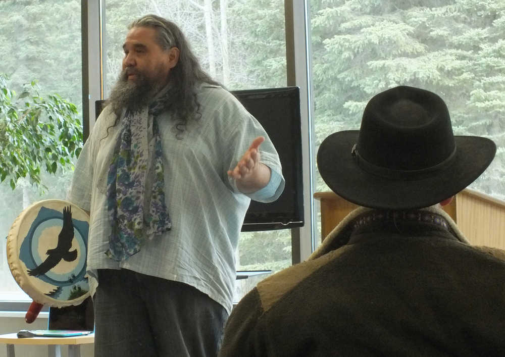 Ben Boettger/Peninsula Clarion George Holly tells about his composition of the Dena'ina-language song "Kahtna Tuygea" during the Alaska Native Oratory Society's speaking event at Kenai Peninsula College on Friday March 27.