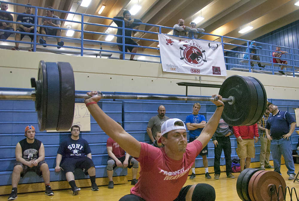 Photo by Rashah McChesney/Peninsula Clarion  Kenai Central High School senior Jace Baker lifts during a Speed Strength Trainin lifting competition on Thursday March 26, 2015 at Soldotna High School in Soldotna, Alaska.