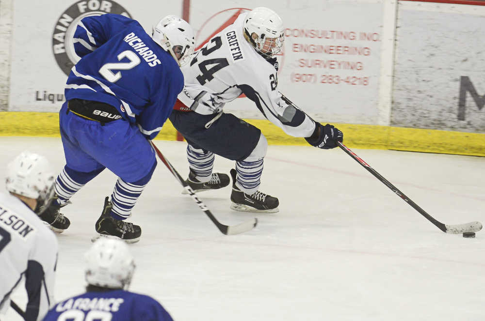 Photo by Rashah McChesney/Peninsula Clarion  In this Dec. 6, 2013 file photo Soldotna's Kenny Griffin gains control of the puck during a game against Palmer at the Soldotna Sports Center in Soldotna, Alaska.