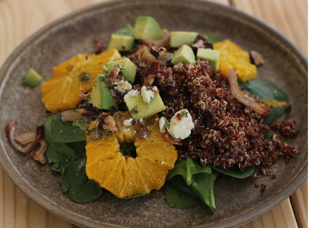 This March 16, 2015 photo shows spinach salad with roasted oranges and shallots in Concord, NH. (AP Photo/Matthew Mead)