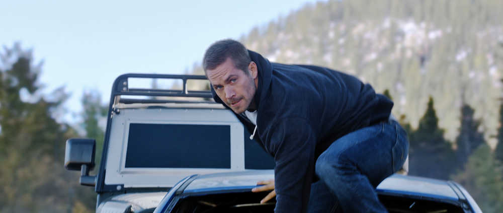 This photo provided by Universal Pictures shows, Paul Walker as Brian, in a scene from "Furious 7."  (AP Photo/Universal Pictures)