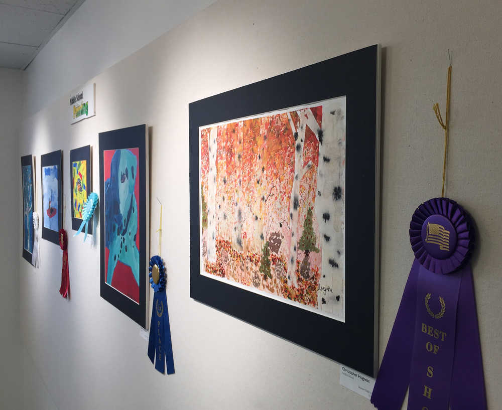 By Ian Foley/Peninsula Clarion Paintings, including the "Best of Show" winner by artist Christopher Hogness, are displayed at the Kenai Arts Guild on Thursday, April 2 in Kenai.