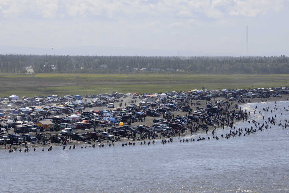 Rashah McChesney/Peninsula Clarion  In this July 20, 2013 file photo, several thousand dipnetters converged onto the mouth of the Kenai River to catch a share of the late run of sockeye salmon headed into the river  in Kenai, Alaska. Fishing pressure has steadily increased in Cook Inlet's personal use fisheries.