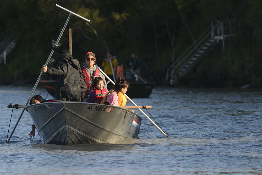 Photo by Rashah McChesney/Peninsula Clarion  In this July 14, 2014 file photo, a  family dipnets in the Kenai River in Kenai, Alaska.