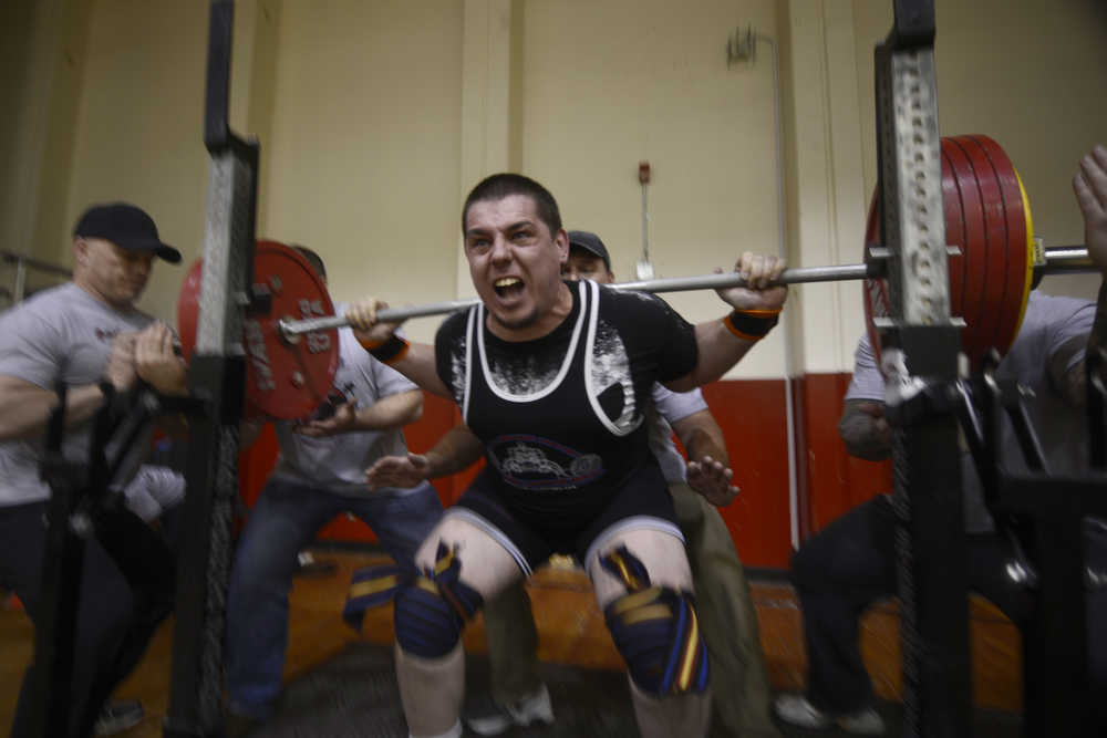 Ben Boettger/Peninsula Clarion  Danny Autrey lifts 253 pounds in a squat during the Kenai Powerlifting meet on Saturday, April 11 at Kenai Central High School. Autrey took first place in men's competition at the meet.