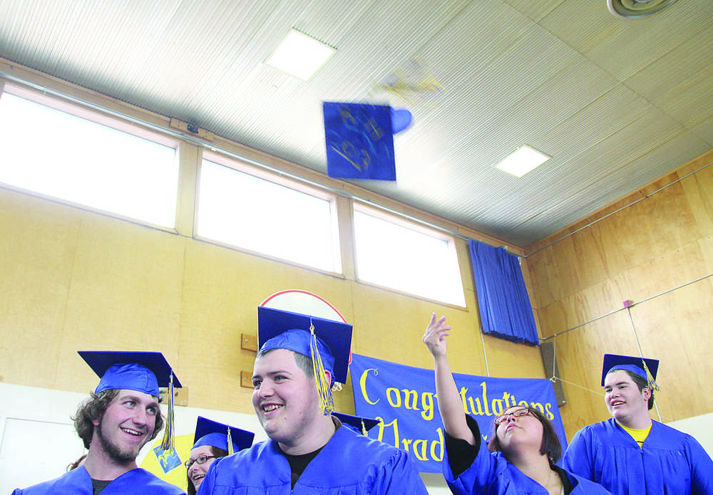 Clarion file photo In this May 21, 2013 file photo Rose Price, 19, throws her mortarboard into the air in celebration at the close of Kenai Alternative High School's graduation ceremony.