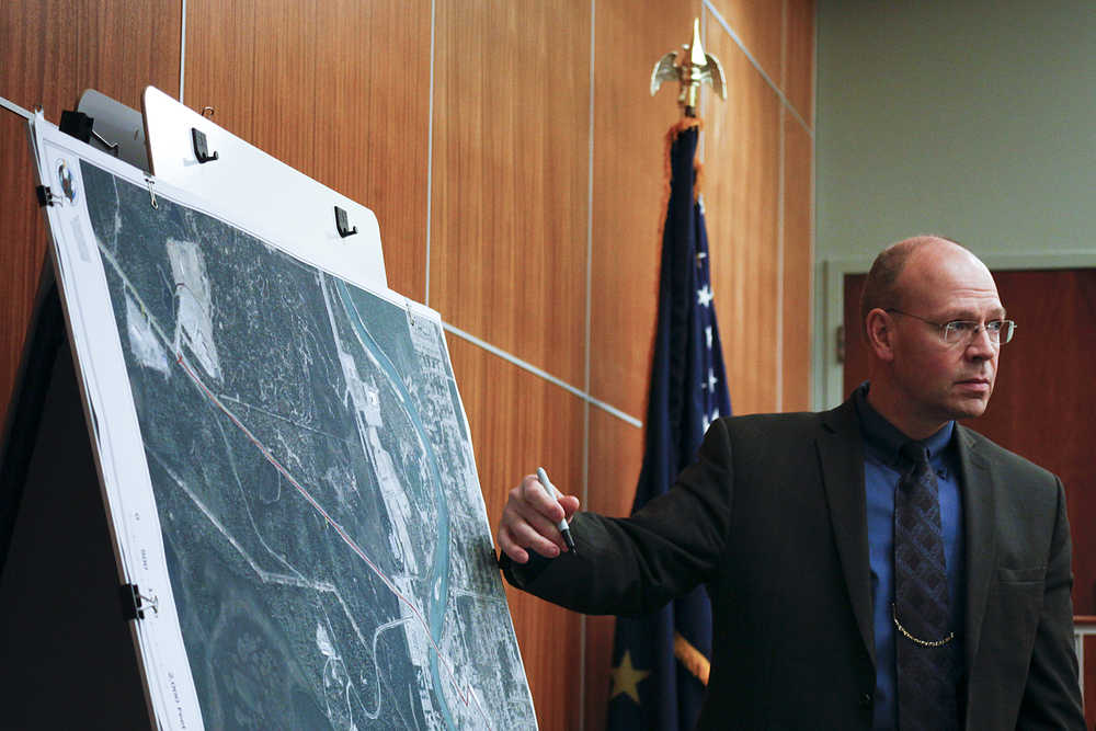 Photo by Rashah McChesney/Peninsula Clarion  Alaska State Trooper Investigator Mark Pearson listens to Public Defender Josh Cooley during Shane Heiman's trial for burglary, attempted rape, assault and resisting arrest on April 15, 2015 in Kenai, Alaska. The defense and prosecution rested Thursday and closing arguments will be heard Friday before the jury begins delibrations.