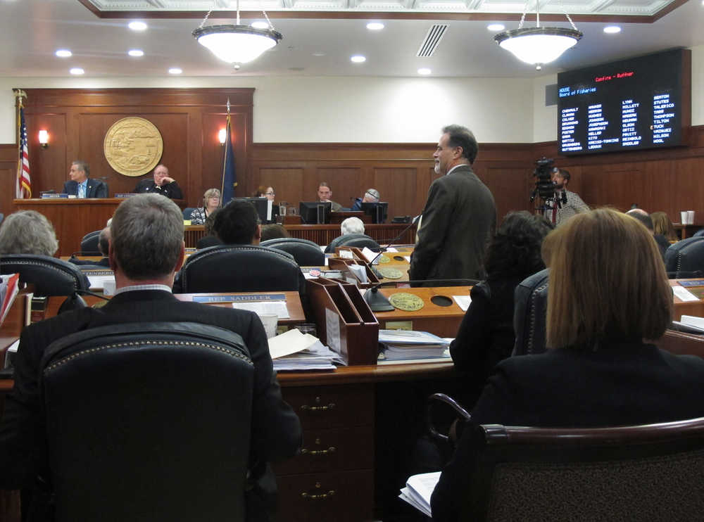 Sen. Peter Micciche, standing, speaks in support of Robert Ruffner, one of Gov. Bill Walker's nominees to the Board of Fisheries, during a joint session of the Alaska Legislature on Sunday, April 19, 2015, in Juneau, Alaska. Ruffner was among the Walker appointees considered for confirmation during the joint session. His appointment was rejected. (AP Photo/Becky Bohrer)