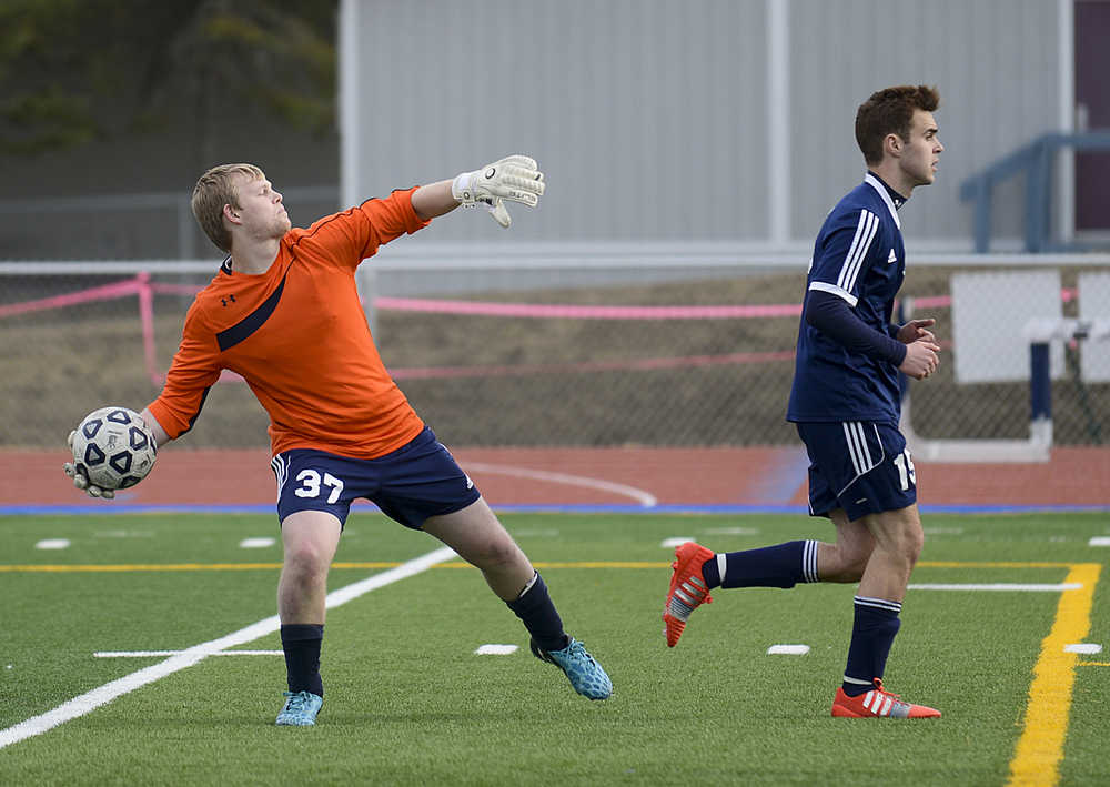 Photo by Rashah McChesney/Peninsula Clarion  Eagle River goalie Chris Jensen throws the ball down the field during their game against Soldotna High School on Friday April 24, 2015 in Soldotna, Alaska.