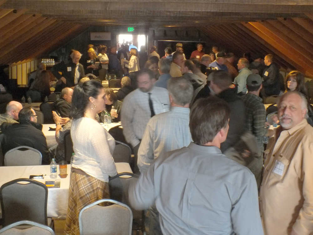 Ben Boettger/Peninsula Clarion Attendees talk to each other during the Alaska LNG Project's business information session  on Wednesday, April 29 at the Cannery Lodge in Kenai.