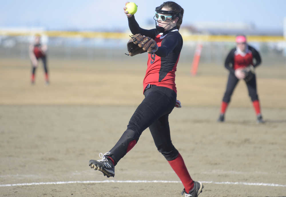 Photo by Kelly Sullivan/ Peninsula Clarion Kenai Central High School Kardinal Cierra King winds up for a pitch Thursday, April 30, 2015 at the Steve Shearer Fields in Kenai, Alaska.