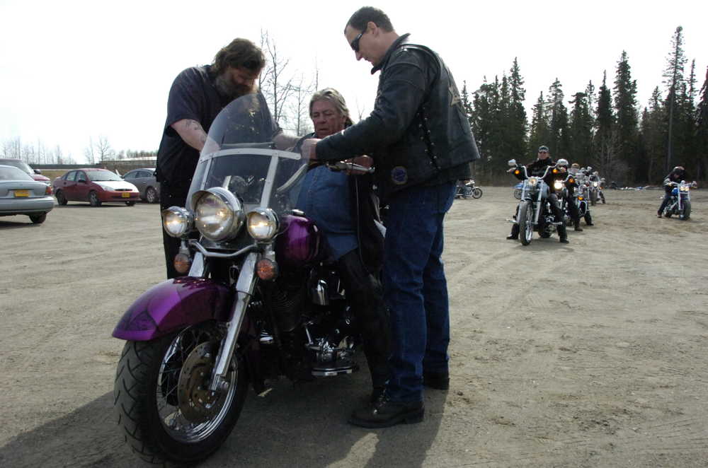 Photo by Kelly Sullivan/ Penisula Clarion Scott Hamann, left, blesses Gary Anderson and his Heritage Softail Sunday at the Nikiski Nazarene Church in Nikiski. The annual event is held for two purposes, Hamann said. "It can bring people to Christ" and bless people on their rides for the rest of the year. "We look forward to this. There are a few people that might need it more than me," Anderson said with a laugh. "We have a couple new ones this year, who didn't know what to expect." Anderson said he has been attending the blessing for nearly two decades, and drove from Ninilchik Sunday morning.