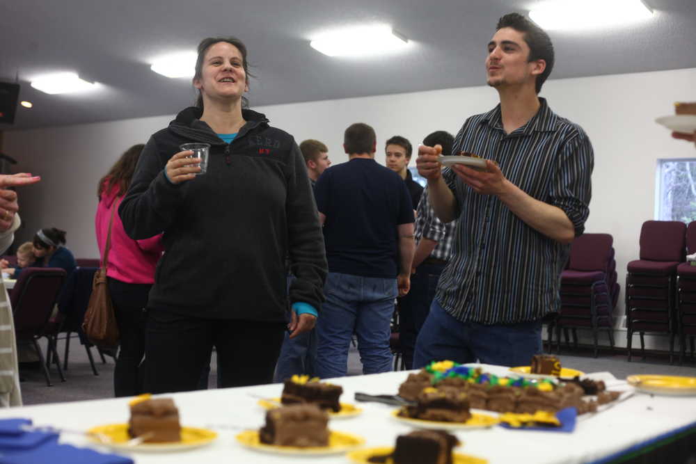 Photo by Kelly Sullivan/ Peninsula Clarion William Roth (right) discusses his post graduation plans at the IDEA home schooling support program's 2015 graduation ceremony Tuesday, May, 5, 2015, at the Kalifonsky Christian Center in Kenai, Alaska.