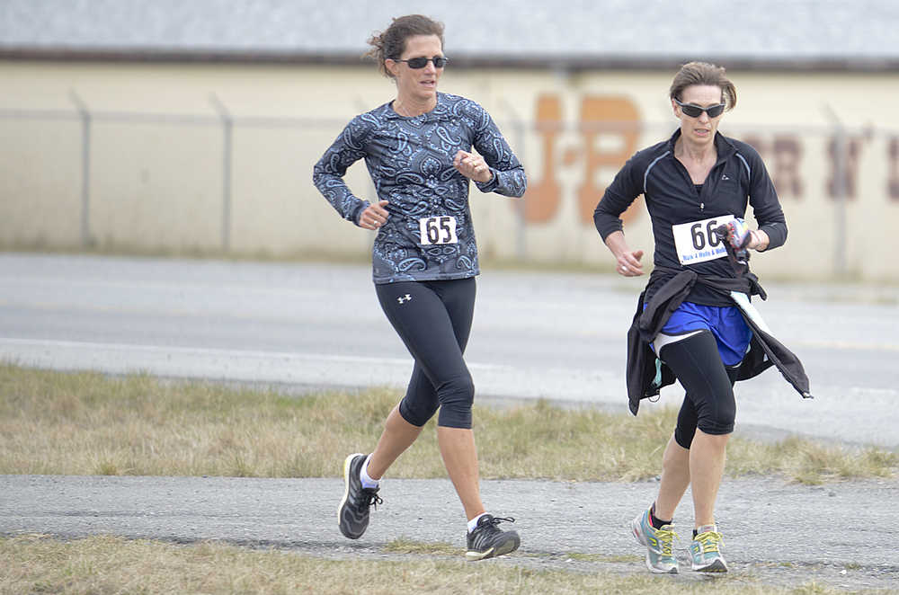 Photo by Rashah McChesney/Peninsula Clarion (left) Connie Best, of Soldotna and Kenda Blanning, of Kenai, finish the Care 2 Run race on Thursday May 7, 2015 at the Grace Brethren Church in Soldotna, Alaska.