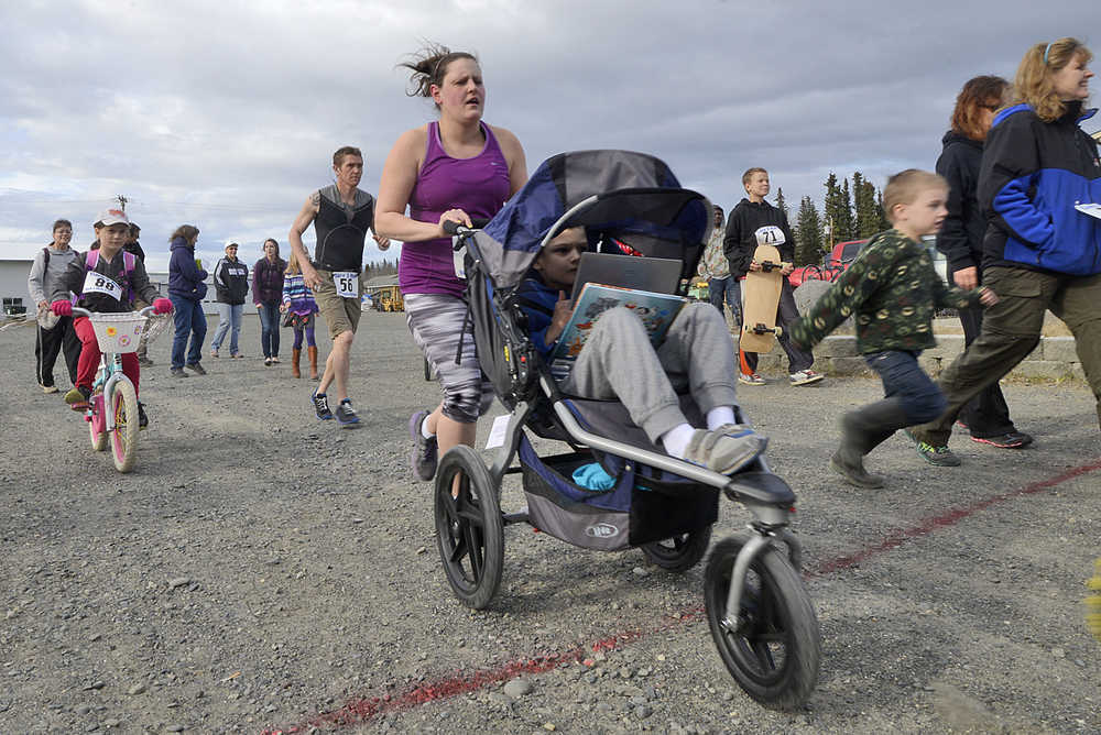 Photo by Rashah McChesney/Peninsula Clarion Dozens of runners, bikers and walkers participated in the Care 2 Run race on Thursday May 7, 2015 in Soldotna, Alaska.