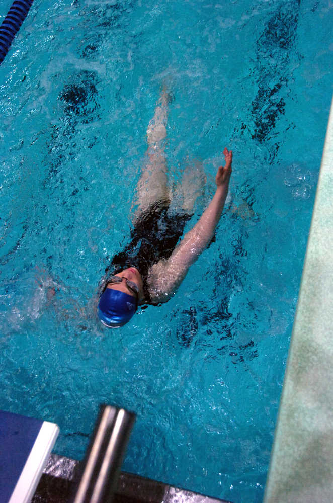 Ben Boettger/Peninsula Clarion Myrna Kuchenoff swims backstroke during the Special Olympics swim meet on Saturday May 9 at the Soldotna High School swimming pool. Last year, Kuchenoff won a gold medal for 100 meter freestyle at the National Special Olympics in New Jersey.