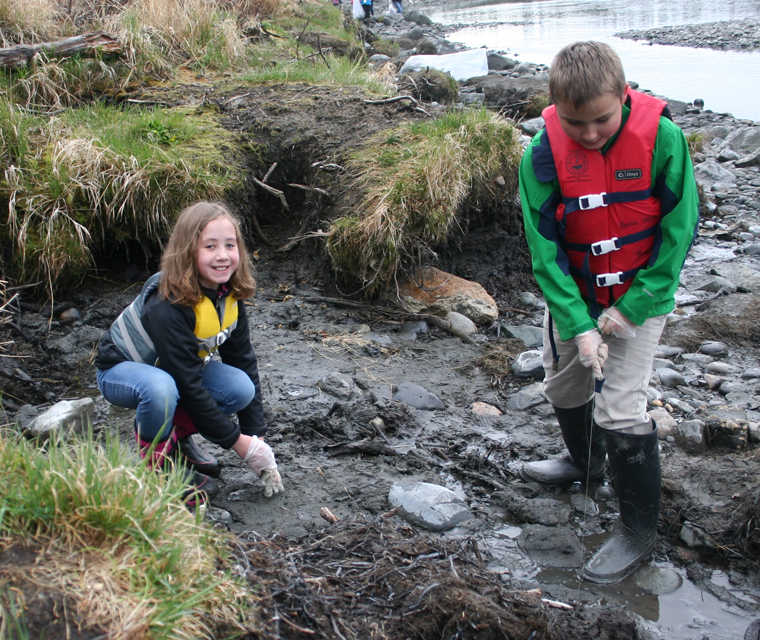 Kids collecting trash help Kenai River Spring Cleanup