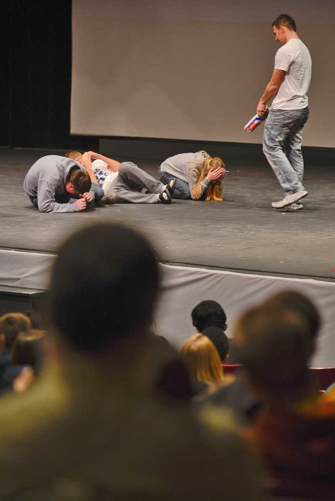 Photo by Rashah McChesney/Peninsula Clarion  In this Jan. 22, 2015 file photo, students at Soldotna High School watch a demonstration of a shooter coming after students, during an ALICE -  Alert, Lockdown, Inform, Counter, and Evacuate - training in Soldotna, Alaska.