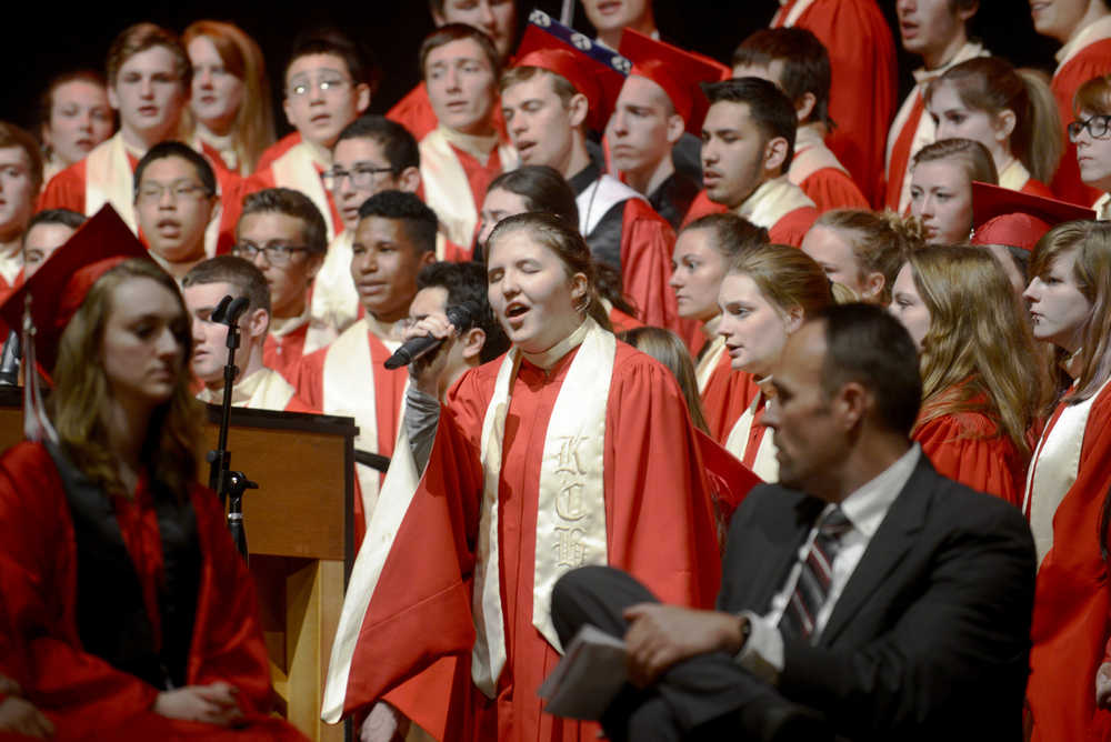 Ben Boettger/Peininsula Clarion Graduating senior Brittany Gilman sings a solo in a performance of "Bridge over Troubled Water" during the Kenai Central High School graduation ceremony on Monday at Kenai Central High School.