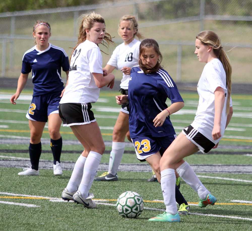 Homer sophomore Hannah Mershon weaves through trafffic during a 4-0 loss to the Knights in the Northern Lights Conference quarterfinals May 21 at Colony High School in Palmer.