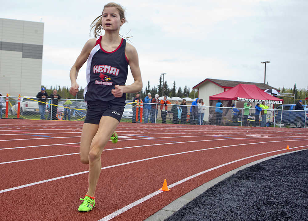 Photo by Rashah McChesney/Peninsula Clarion  Allie Ostrander stays well ahead of the pack during the girls 1600 meter race at the Region III championships on Saturday May 23, 2015 in Kenai, Alaska. Ostrander finished with a time of 4:48.32, the fastest so far this year in Alaska.