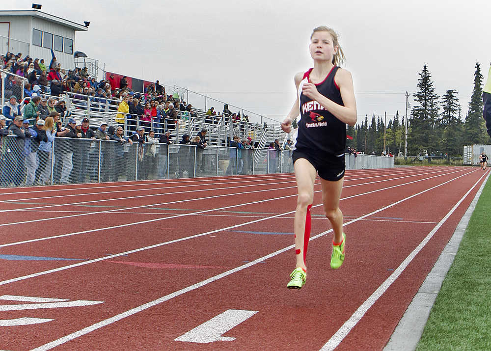 Photo by Rashah McChesney/Peninsula Clarion  Allie Ostrander stays well ahead of the pack during the girls 1600 meter race at the Region III championships on Saturday May 23, 2015 in Kenai, Alaska. Ostrander finished with a time of 4:48.32, the fastest so far this year in Alaska.