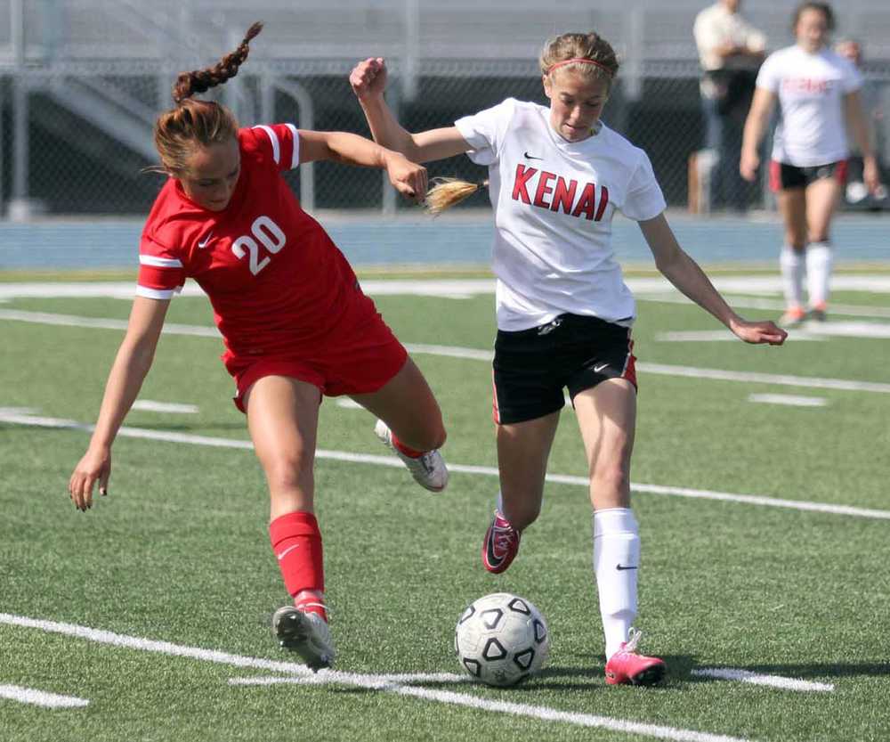 Kenai's Samantha Morse takes possesion away from Wasilla's Lydia Phillips during a 2-1 overtime win over the Warriors in the Northern Lights Conference semifinals May 22 at Palmer High School.