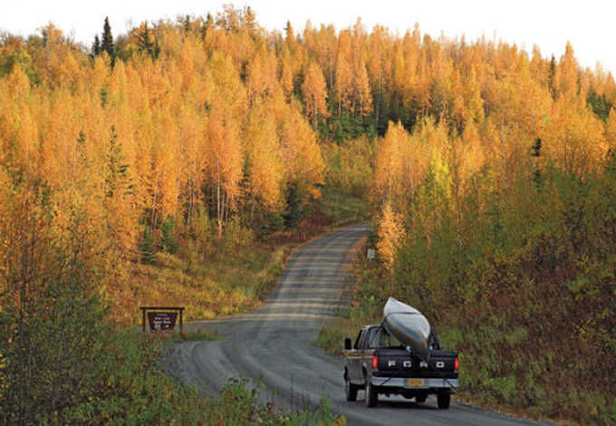 Clarion file photo A canoe-laden truck makes its way down a Kenai National Wildlife Refuge road. The Refuge has proposed some changes to the way people can use vehicles on its land, allow for harvest of edible plants and increase restrictions on camping, among other things.