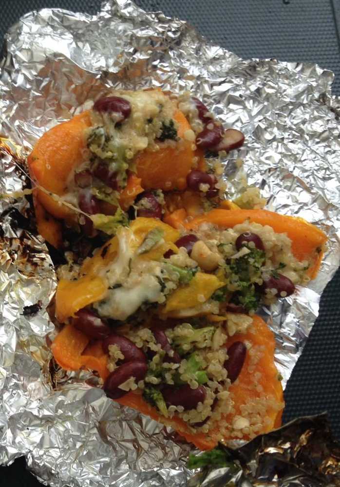 ADVANCE FOR USE MONDAY, MAY 25 -  In this photo taken May 9, 2015, quinoa-stuffed bell peppers, made by Lauren Frisch and Sam Friedman, is displayed during a campsite cookoff  at the Granite Tors campground near Fairbanks, Alaska.  Everything tastes better on a camping trip, but that doesn't mean camp food can't be improved on. (Sam Friedman/The Fairbanks Daily News-Miner via AP) MANDATORY CREDIT