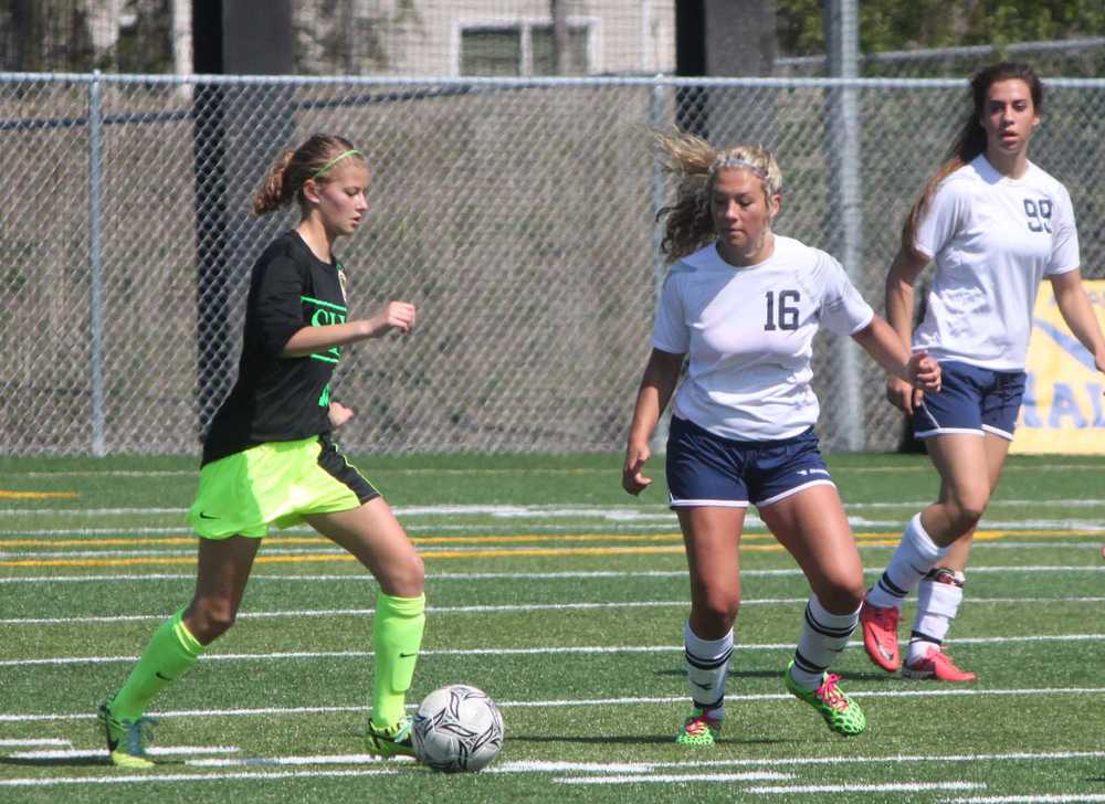 Soldotna senior Skylar Shaw (16) looks to steal the ball away from Service freshman Lauren Hepler in the first half of Thursday's girls state quarterfinal match at Bartlett High School in Anchorage. The Stars lost 2-0 to the Cougars.