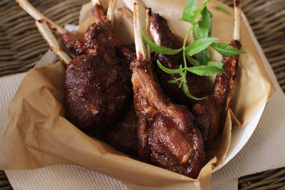 This April 20, 2015 photo shows sweet and spicy grilled lamb chops in Concord, N.H. (AP Photo/Matthew Mead)