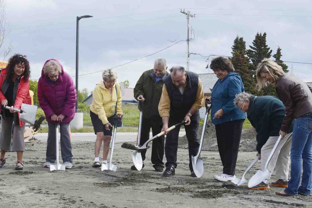 Photo by Kelly Sullivan/ Peninsula Clarion The Kenaitze Indian Tribe's Elders Committee and Executive Director Jaylene Peterson-Nyren break ground at the new Tyotkas Elder Center groundbreaking Monday, June 8, 2015, in Kenai, Alaska. The center provides services to tribal elders including meals and clinics in health and education, Peterson-Nyren said.  The new building will be 6,500 square feet, which 1,500 square feet bigger than the old center, which was demolished in April because of damages resulting from a gas leak found in the building in June, 2015, said the tribe's Communications Manager Scott Moon. Before the Kenaitze Indian Tribe purchased the building more than ten years ago, it had been used as a general store; restaurant and pharmacy, said the tribe's Executive Director Jaylene Peterson-Nyren. The new center is within walking distance from the Dena'ina Wellness Center and was designed by Kahtnuht'ana Development Corp, a new corporation whose sole shareholder is the tribe, Peterson-Nyren said.